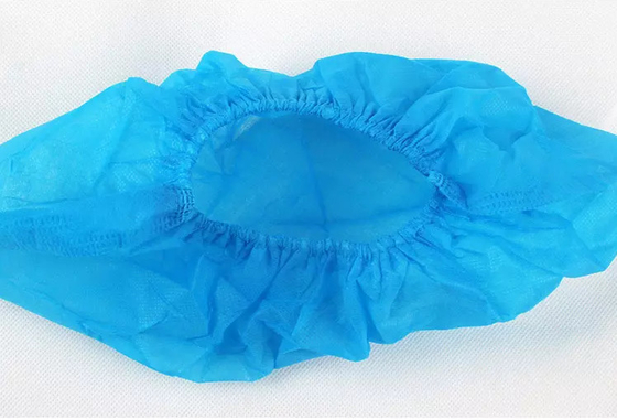 Nicht gesponnener blauer Schuh umfasst Wegwerfantigleiter weiches freundliches Eco